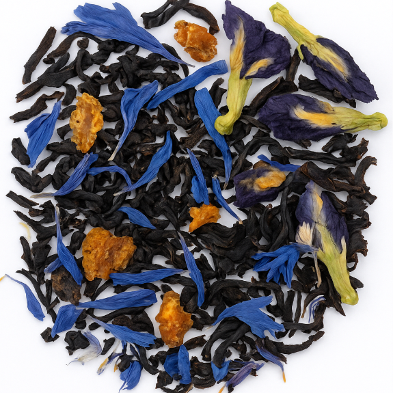 Black tea leaves with blue and yellow flowers on a white background