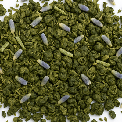 Green tea leaves with small white flowers on a white background, labeled 'Emerald Frost Court'.