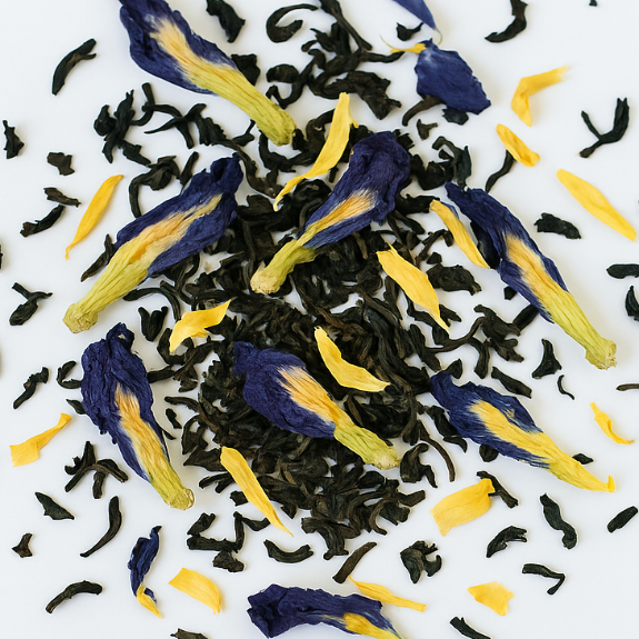 Indigo Harvest tea with blue and yellow flowers on a white background