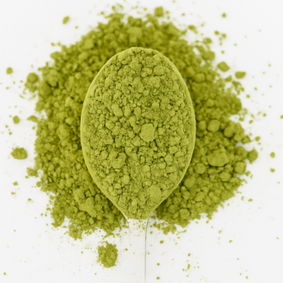 Green powder in a spoon with 'Leaf & Legend' text on a white background