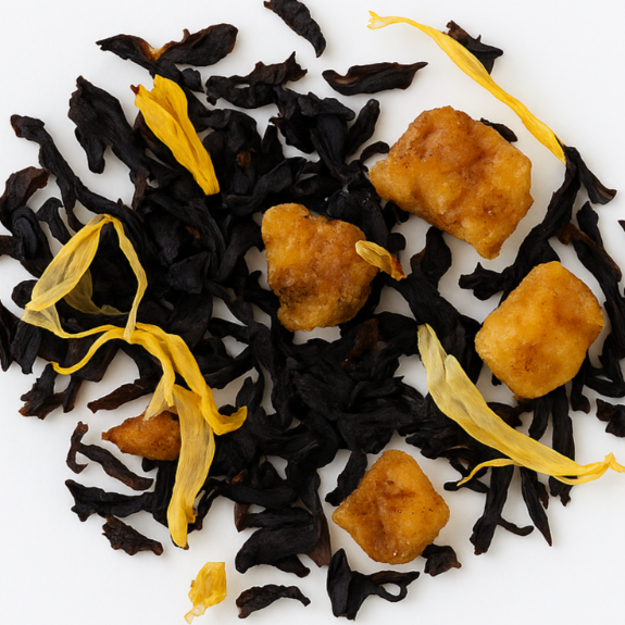 Tea leaves with yellow flowers and brown cubes on a white background, branded 'Parcha & Pages'.