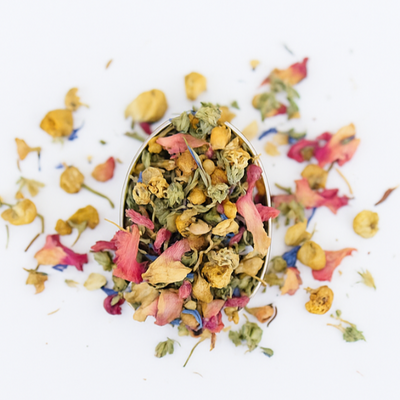 Colorful dried flowers in a small container with 'The Last Page' text on a white background