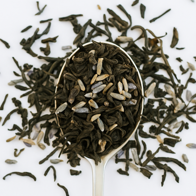 Tea leaves in a spoon on a white background